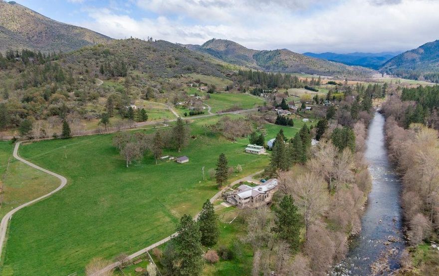 AN OREGON DREAM w/approx 700 ft of Applegate River frontage & water rights for 10 acres of Irrigation! Fly Fish on your own property! Minutes to Applegate Lake & Jacksonville. Timber frame post & beam w/vaulted ceilings, rustic trusses, an architectural masterpiece! 2 family set up, 1bd/1ba cottage is attached w/ vaulted wood bm ceilings, open ktchn to great rm w/wood stove, separate doors to river view. Main hm 8ft glass doors, w lg windows, open beams & many built-ins throughout. Open kitchen w lg island granite counters, 5 burner cooktop lg vaulted open beam ceilings & European style cabinets, walk-in pantry. Lg great rm, w/flr - ceiling windows w/river views, lg beam & stucco wall, wood burning frplc, French doors to decking, 3 Mastr suites, 1 w lg sitting area, open railing, artistic staircase. Lg office loft w/river views. Lg unfinished basement. In-ground sprinkler, hay shed, 48x40 shop/garage w full bath, wine cellar, work benches, & storage area, garden area & fruit trees.