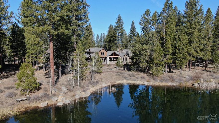 Lakefront views - Just completed March 2020! Luxury and exquisite craftsmanship plus ample gathering spaces make this the perfect home for large families, reunions, retreats and special get-a-ways. There are three master suites on main level along with great room, gourmet kitchen, laundry/mud room. Upstairs find two more suites, + bunk/bonus room. Expansive paver patio with hot tub for relaxing or entertaining. Contact your agent to preview today.