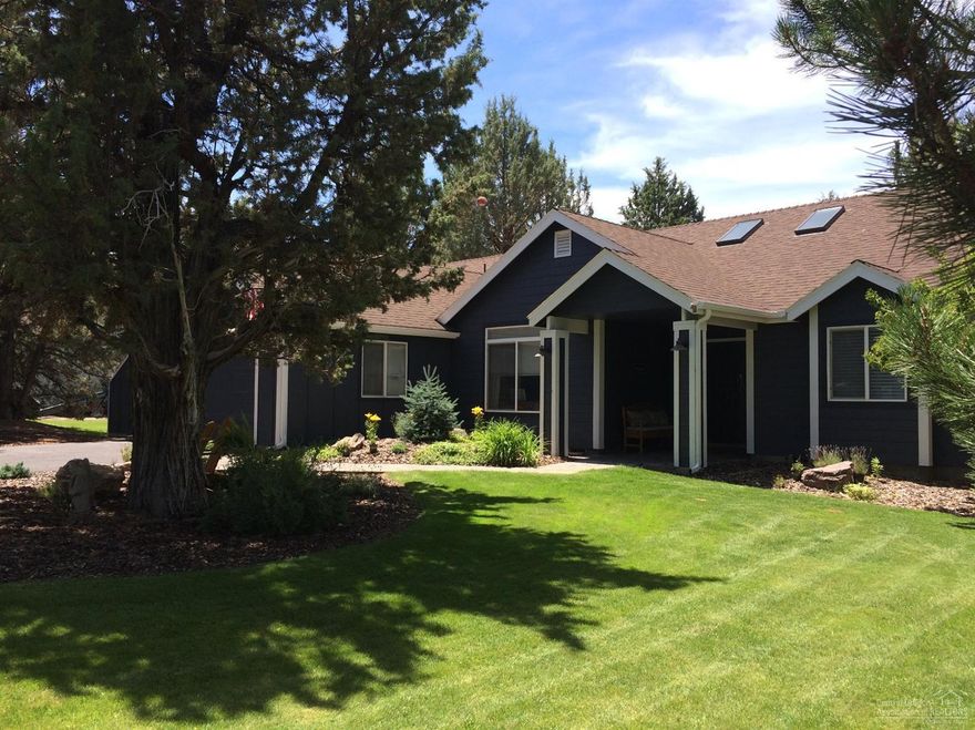 On the Resort side of Eagle Crest! Single level w/Master separation, den/4th bdr. off entry, newly updated kitchen w/stainless appliances & slab granite, vaulted ceilings, skylights, custom rock fireplace and mantle, custom light fixtures & window coverings. Great outdoor entertaining on the large deck w/hot tub. Backs to common area and 5 acre parcel. Private neighborhood pool and tennis court, & access to 3 golf courses, sport centers with gyms, indoor/outdoor pools & tennis. Lots of paved and river trail