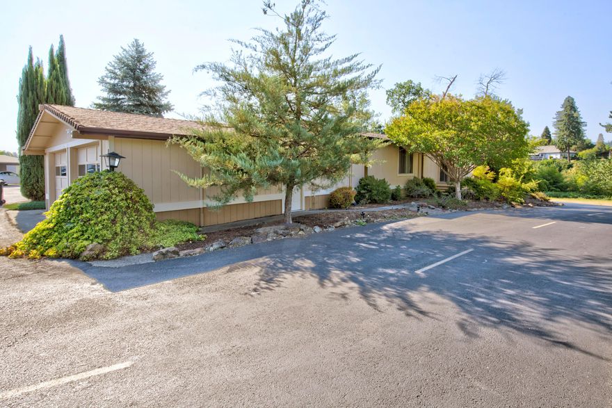 This home is located on a fantastic, picturesque, large corner lot in one of the premier 55+ manufactured home parks. The home has a wrap around deck to allow for a 180 degree view of the Rogue River and local wildlife.  The 1344 sq ft 2 bedroom 2 full bath double wide has BRAND NEW A/C UNIT,  lots of room including large living room, dining room with built in hutch, family room, large master bedroom with 2 closets  and nice size bath. The second bedroom is good size with access to the second full bath. Property includes oversized 2-car garage with separate workshop with bench and custom storage cabinets. There is additional storage in the wooden shed for extra tools, etc. There is RV/boat storage for residents, as available. Buyer must apply for park approval with management.