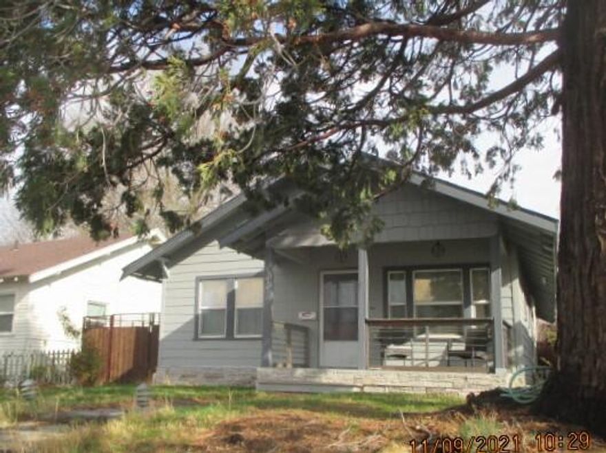 This home is immaculate!  All rooms are spotless, the owners did a lot of updating and painting.  All furniture except the TV is included.  Home has a one-car garage and carport with alley access.  OWC with 30% down and approval.  Property was recently surveyed.