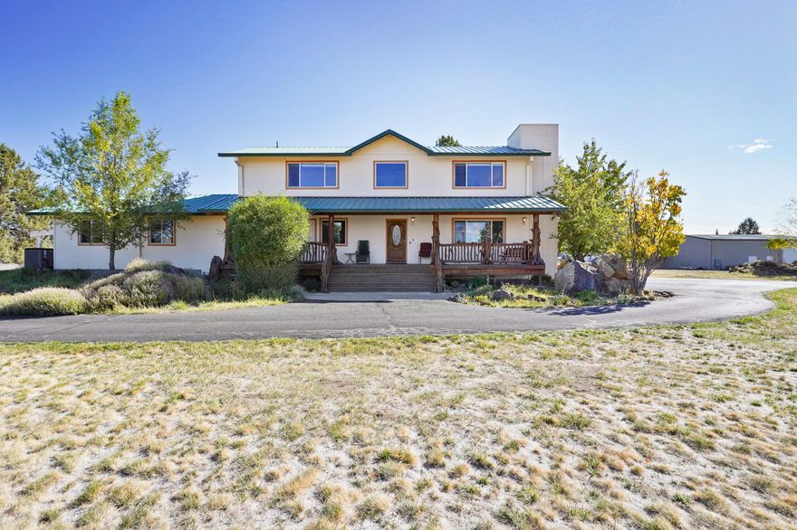 Here it is! You have been asking for this 7 acre  property with Cascade Mountain Views, a lovely home, large ADU, Huge Shop, Irrigation, ADA compliant throughout, including an elevator and is  5 minutes to Costco! Could serve well as a multi-generational set up. The  main house is 2,440 sf with 4 bedrooms, a bonus room, a media room, 3 bathrooms, great room, large heated 2 car garage with lift and much more.  The separate entranced ADU is 1560 sf with nice finishes. It has a big primary bedroom with ADA shower, dual sink and big walk-in closet, nice light great room, additional  bonus room including a second full bath with dual sinks and a 2 car carport. There is a 2,400 sf shop with separate mezzanine. Also has a small barn and chicken coop.  Lots of room to park all your toys, trailer and RVs.