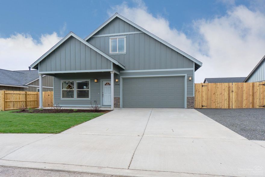 New construction in NW Redmond's Crane Meadow. 3 bedroom, 2.5 bath home with 2047 sq ft of living area & RV parking! Large Great Room with gas fireplace opens to Dining and Kitchen with island and eating bar. Knotty Alder cabinets with quartz slab counter tops, all stainless appliances. 30 year roof, forced air gas . Separate utility room. Double car attached garage. Landscaped front with sprinklers. Single level home with great curb appeal. Model Open Sat & Sun 12-3pm at corner of NW 19th & NW Larch