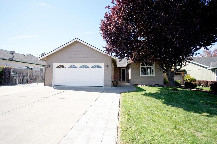 Nicely updated home conveniently located near schools, shopping and medical. Home features new exterior paint, new roof in 2011, granite tile counter-tops in the kitchen. Engineered hardwood floors throughout with carpet in the bedrooms. Home is nicely landscaped with in-ground sprinklers and paved RV parking. Amazing views of Roxy Ann and Grizzly Peak. This one won't last long! Seller is a licensed real estate broker in the State of Oregon