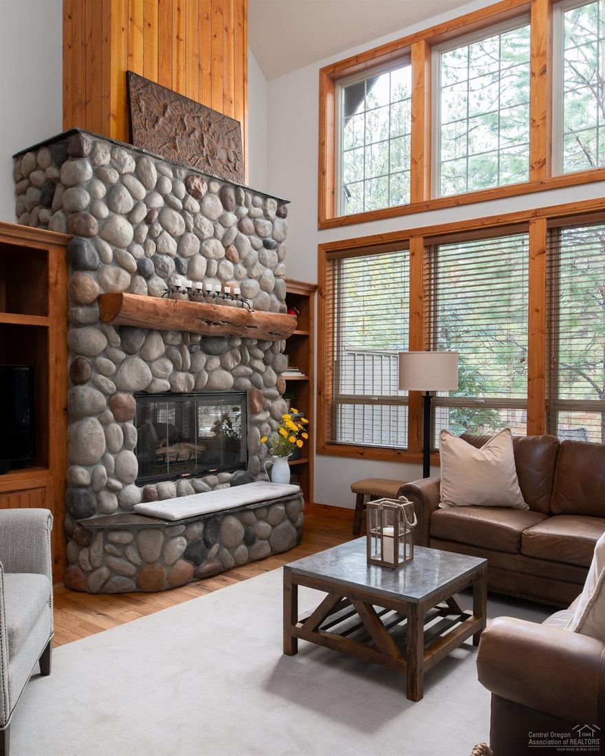 Meticulously maintained and stylishly appointed, this lodge style condo boasts an open forested area beyond the outdoor living area. This gem features two gas fireplaces, one in the great room and the other in the master suite. Recent upgrades include newer stainless-steel appliances, gorgeous hickory hardwood floors, lighting and carpet. Enjoy slab granite counter in the kitchen with an eating bar and knotty alder cabinets. A log and iron staircase lead you to the bedrooms. Custom landscaping and paver patio. Outstanding HOA takes care of the outside entirely while you sit by the water feature and enjoy the wildlife that prevails in the Sunriver community. Prewired for alarm and Air conditioning. NEVER rented. SHARC paid. Hot tub installed in 2014.