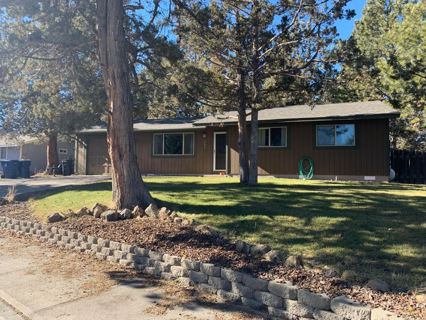 This single level rancher is the definition of CUTE on a quiet cul-de sac right across from Kiwanis Park in a close-in SE Bend location on a HUGE RM zoned lot. The fenced yard provides an amazing opportunity for your own private oasis with large gear shed and underground sprinklers in front and back yard. The kitchen and bath have granite counters, new interior paint, newer propane stove, and newer roof. Hardwood floors throughout- there is no carpet in this home! One car garage is attached. Make this adorable home yours by calling your favorite Realtor today.