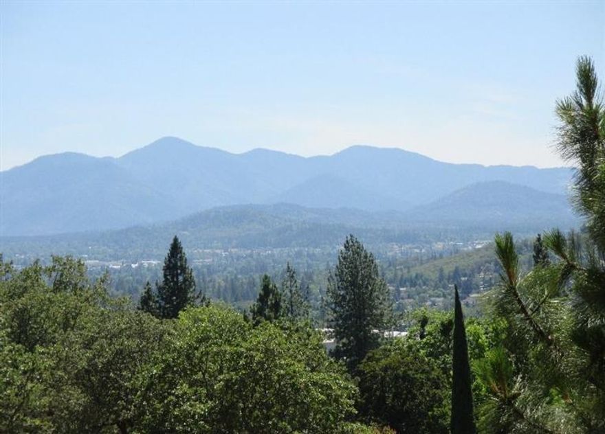 Almost 10 acres of privacy, a 20 GPM well and a dynamite view of Grants Pass and the valley beyond. Well report on file, and there's power and phone to edge of property. Non Forest Dwelling home site approved. Standard septic system is installed. Located in District 7 schools, right at the edge of town...enjoy the rural setting and convenience to town.