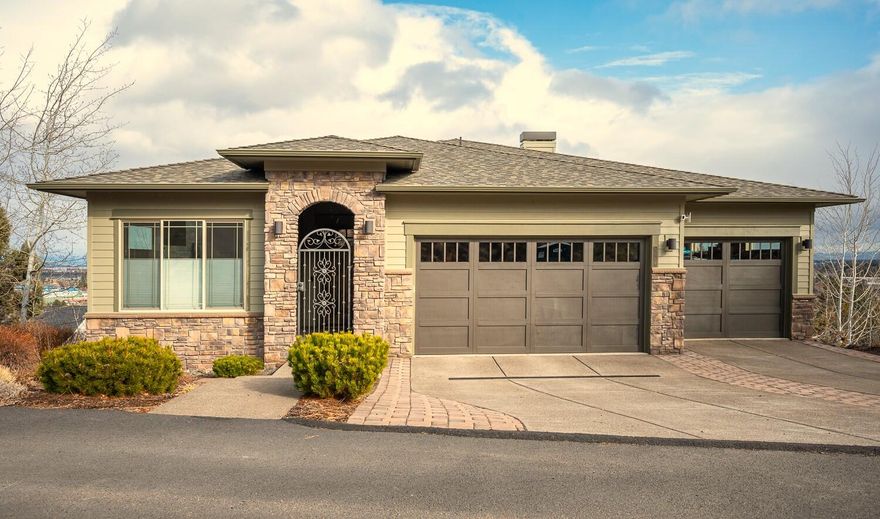 Featuring 180 degree panoramic mountain and city views, this River's Edge home combines northwest and contemporary designs with an open layout throughout. The main level flows effortlessly with beautiful hardwood floors, hand troweled walls, chef's kitchen with custom cabinetry and quartz counters, spacious primary suite, office, wall to wall windows taking in the views, stone accents. The lower level mirrors the main level with an open layout, guest suites, theater room, kitchenette, living room, covered deck with stellar views, and approx 410 sq ft bonus room addition to use as storage space, wine cellar, secure room. Protected covered decks on both levels. Main level primary suite has spacious bath, tiled shower, soaking tub, two closets, deck access. Scenic views from almost every room. Sizeable triple car garage. Smart Home with surround sound system and electronics at 30K value. Short walk to River's Edge golf course, clubhouse, and close to the Deschutes River and trails.