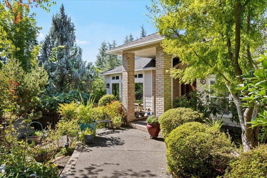 Set on a spacious .28 acre lot, this beautiful home offers a blend of comfort and convenience.  The main living area is one level for easy accessibility.  A bright layout with new windows, vaulted ceilings and views.  The spacious kitchen features granite countertops, double wall ovens, a 5-burner gas cooktop, dishwasher, pantry and heavy duty pull out drawers.  Off the kitchen is a dining room, large living room and family room with a gas fireplace.  Just outside, the covered patio extends your living space outdoors, ideal for entertainment.  The large primary suite has a sitting area, en-suite bath and walk-in closet.  There are two additional bedrooms, a guest bathroom and large laundry room.  Downstairs, a daylight room with full bath and 2 exterior doors that lead to another covered patio with hot tub.  The beautifully landscaped backyard has mature fruit trees and raised garden beds.