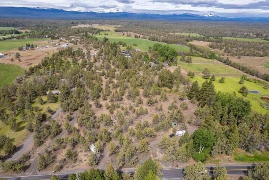 Extremely desirable West Tumalo, 7.14 acres, unobstructed Cascade Mountain Views, multiple locations for custom home, over 4 acres of irrigation, w/ irrigation creek/canal running scenically through the gorgeous, tranquil, amphitheater-view rare legacy land piece. Private entry, fencing on North and East sides, selectively treed. Ideal location for mini ranchette or estate, raise your horses and animals here. Operate your own self-sustaining farm. Grab it while you can, this lot will not last long!