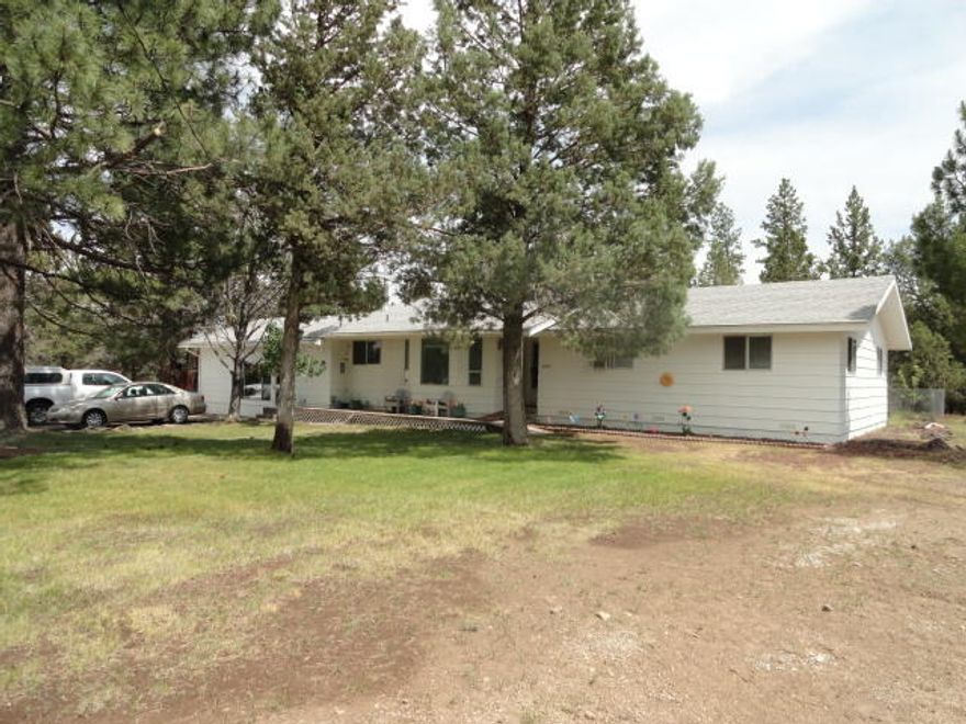 Nice large home in Bly Oregon. This home features a Large Living room with a Fireplace and wood burning insert. Primary Bedroom has a full Bath-room .  Hallway Bathroom has double sinks and a walk-in shower, Large Screened in Porch and an enclosed area to keep firewood. Converted Garage is set up as a Game -Room. 35x30 Shop with cement floor and has Electricity. Shed in the back yard. Parklike Yard with many mature trees. One of the nicest homes in Bly. Lot 29 is also included in the sale.