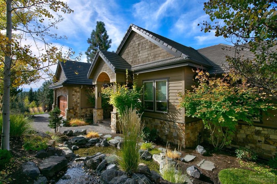 Stunning NW architecture, located in Skyliner Summit. Views of the Cascades with many upgrades and exceptional craftsmanship throughout the home. Pristine manicured yard w/water feature. Main level living w/Master and one guest suite, two additional guest suites downstairs, w/family room, theater room, and extra storage. Gourmet kitchen w/granite, Dacor & Sub-Zero appliances, dedicated office with two workstations, oversized two car garage with third bay converted to carpeted shop and built in cabinets.