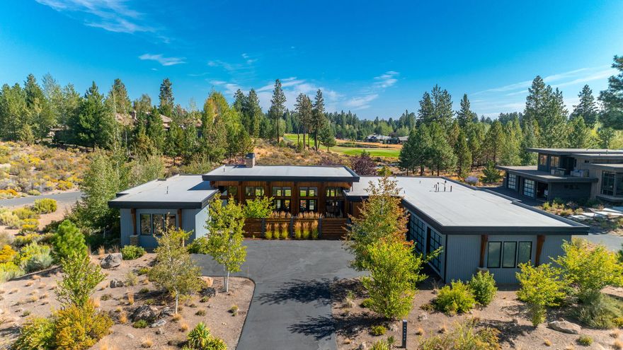 Nestled within Tetherow's prestigious gated community, this one-level residence offers luxury and natural beauty. With stunning views of Mt. Bachelor and the 5th hole of Broken Top Club, the home boasts an open floor plan where natural light floods through expansive windows, seamlessly blending indoor and outdoor living. The great room, anchored by a modern gas fireplace, flows into a gourmet kitchen and dining area, perfect for gatherings. Outdoors, an expansive backyard and an additional gas fireplace provide a serene retreat. Featuring two primary suites, this home offers privacy and comfort.  Designed for those who appreciate both elegance and functionality, this Tetherow gem is a perfect blend of modern living and the serene beauty of the Pacific Northwest. The resort community of Tetherow features 2 swimming pools, fitness classes, restaurants, golf & more.