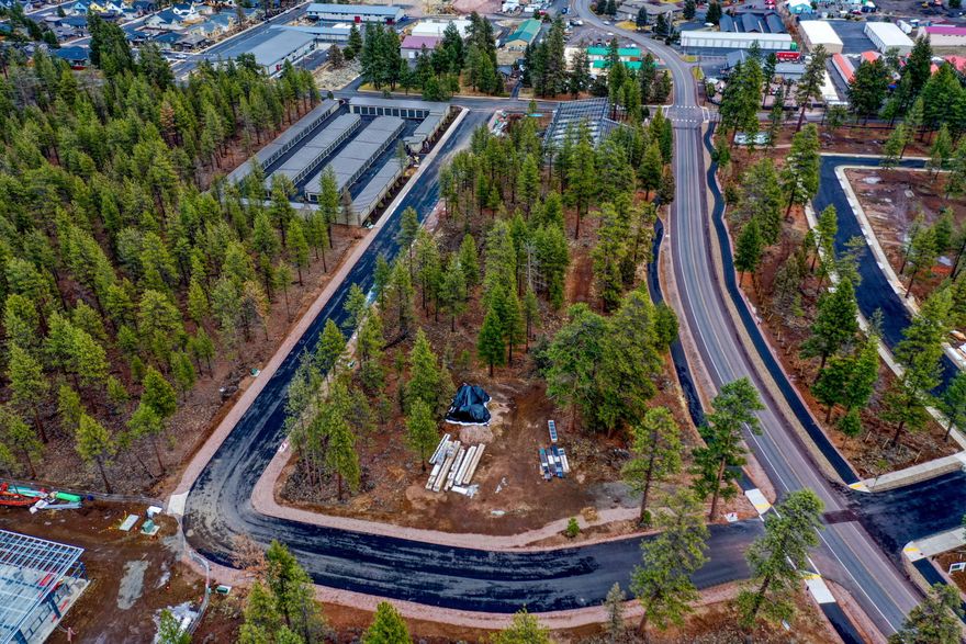 This large 0.86-acre corner lot is zoned ''Light Industrial'' and ideally located in the heart of Sisters, within the Three Peaks Industrial Park. With two access points and high visibility, this lot offers excellent flexibility and development potential. Permitted uses under the zoning include retail, commercial sales, storage facilities, light manufacturing, wholesale and warehousing, research and development, food processing/packaging/storage, and more. (Buyers to perform their own due diligence with the City of Sisters regarding all allowable uses.) Feel free to walk the lot at your convenience!