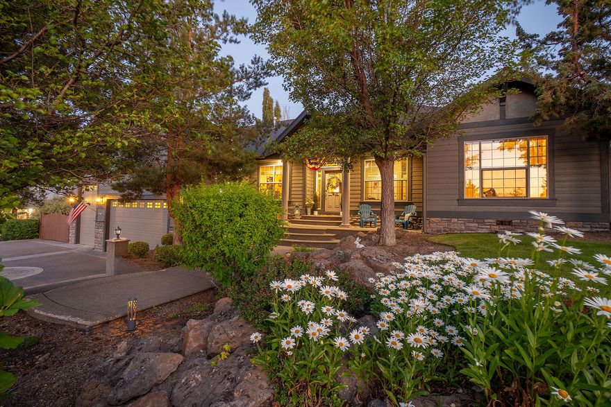 Set in an upscale neighborhood with a spacious, open feel and no neighbors across the street, just peaceful open land. This beautifully updated single-level home is perfect for an active lifestyle. Enjoy newer bamboo flooring, quartz counters, tile backsplash, wall ovens, fresh paint, lighting, and carpet. Featuring hickory cabinets, travertine flooring, crown molding, 20-ft ceiling in the main living, marble entry and French doors to the office. Luxurious primary suite with coffered ceiling, dual sinks, jetted tub, skylights, and large tile shower. 3-car heated garage + extended RV bay features 20 ft ceiling with shop area, and under-home storage. Gated parking fits an RV + boat with dedicated hook-up. Outdoors, enjoy a private retreat with concrete aggregate patios, a covered lounge/dining area, mature landscaping, pond, a meandering stream and waterfall. Redmond blends small town warmth with a revitalized downtown and big outdoor energy, rich in culture, outdoor art and recreation.