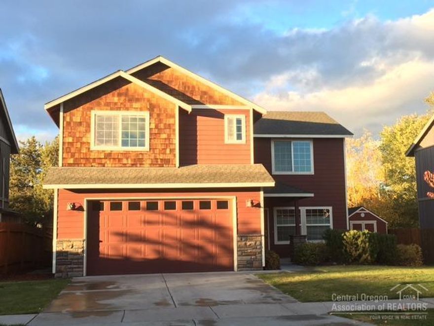 Spacious, NW craftsman style home boasting an outstanding great room floor plan with a large, fenced back yard and an upstairs family room w/ cathedral ceilings! Landscaped front and back, hardwood floors, large rooms, tile countertops, high ceilings, slate back-splash and a gas fireplace w/ slate surround. Very clean home in excellent condition, includes A/C and storage shed. Call your agent, this outstanding home won't last at this price!