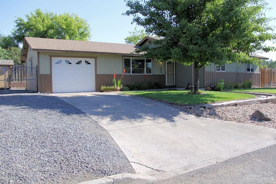 Home ownership at its best! Cottage style home has been extremely well kept & it shows. 1208 sq ft, 3 bed 1.5 bath home has wood flooring, new carpet, updated kitchen & full tile shower bathroom remodeled. Forced air, central a/c, private back yard w/ built in pergola, fully fenced & side yard for storage. Surprise 10x20 fully finished workroom/man cave or extra getaway space outbuilding that is insulated, has full electrical including 220, heating and a/c. Beautiful landscaping and move in ready!!!