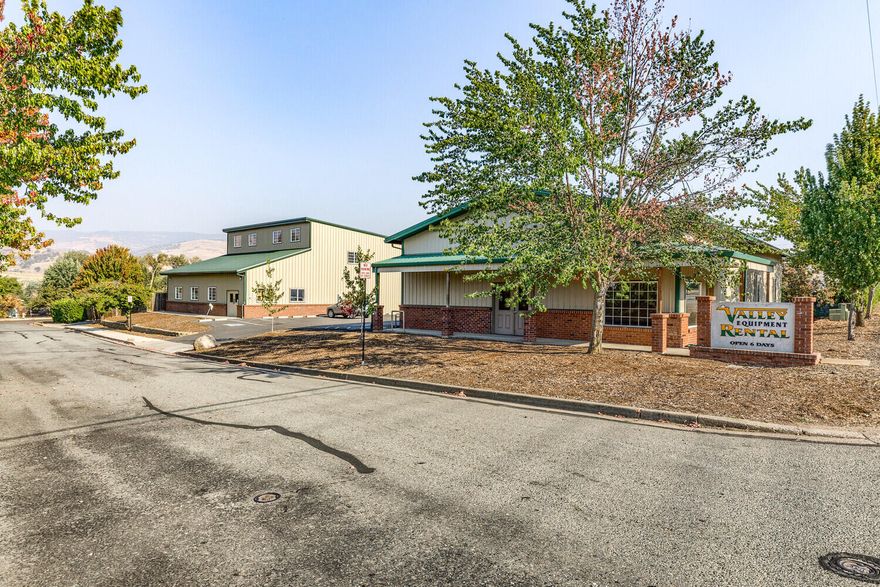 Great opportunity to own 3 adjoining tax lots on a total of 1.4 acres. 2915 Hwy 66/418 Applegate Way is .53 acres and has 2 warehouses, each with their own address, 16' roll-up doors, and half bathrooms with a shared parking area. Both buildings are tenant occupied with combined rental income of $5,600/month. 2915 Hwy 66 is 2,560 sq. ft. with a 400 sq. ft. mezzanine and laminate flooring at the front for showroom and office space. 418 Applegate Way has access to a large side yard for additional storage. The two adjoining vacant tax lots at 430 and 450 Applegate Way are included in this listing, and are .29 acres and .58 acres, respectively. You may purchase the two vacant lots together under MLS #220154978 or 2915 Hwy 66 under MLS #220154977.