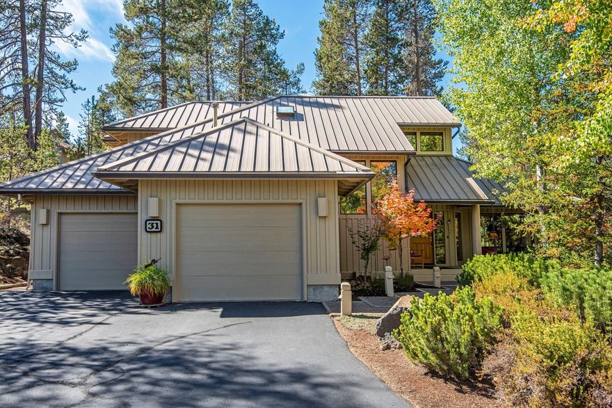 Tucked away on quiet corner lot, this fantastic Sunriver home is ready for you and your family to enjoy! Custom built by Sun Forest, there is a feeling of quality throughout including metal roof & wood wrapped windows. Outside is a covered front porch, as well as a private rear deck surrounded by beautiful landscaping, creating a private oasis where you can relax and soak in the hot tub or just read a book. Inside is an open floorplan w/ generous kitchen w/breakfast bar, pantry, slab granite & stainless appliances. The kitchen opens to a vaulted living room w/ stone fireplace & cedar ceilings.  The main level primary suite has an updated bathroom, wall of windows + direct access to the back deck. You'll also find a second guest bedroom/den downstairs w/ wood burning fireplace, built in desk and access out back. Upstairs is a large landing/loft area with custom built desk/cabinets, as well as 2 more bedrooms and a full bath. Recent updates include new heat pump + water heater in 2019.