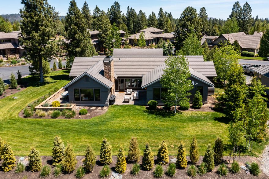 Beautiful mountain modern home situated on a private end of cul-de-sac estate lot in Broken Top with long-range views of the high desert landscape and Cascade Mountains. Custom designed with generous wood windows that flood the home with natural light and nature while preserving privacy. A comfortable flow of indoor-outdoor living with multiple courtyards and patios provides a space to enjoy the outdoors no matter the time of day. The gourmet kitchen features an expansive island, generous pantry, oversized Bertazzoni range and hood, and built-in Sub-Zero refrigerator. The flexible single level floor plan has room for everyone including a primary suite with a spa-like bath, second en-suite bedroom and separation from two additional guest bedrooms. High quality finishes include walnut floors, two-sided fireplace to the outdoors, custom millwork and built-ins and designer fixtures. This home features many recent upgrades and lives like new. This is Central Oregon living at its best!