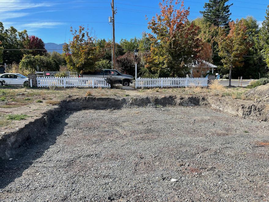 Prime lot location in the Old Bridge subdivision. This .15 acre lot has frontage onto Talent Ave and alley access behind for Garage entry. Previous home was 2155 sqft. The lot has been cleared, cleaned and certified and ready to build.