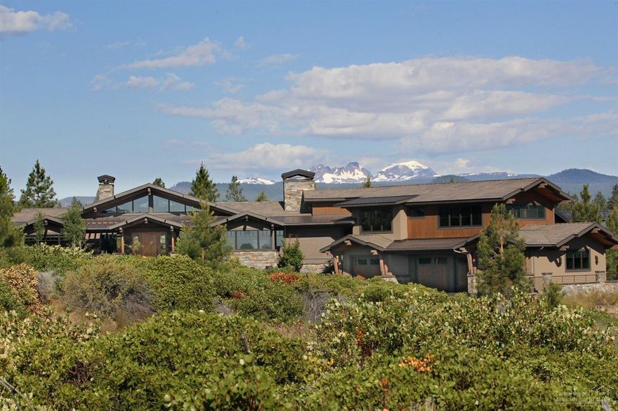 Impeccably hand-crafted, luxurious NW Modern retreat built in 2015 by PacWest Builders, this pvt Cascade Mtn view home backs to Nat'l Forest & parallels Tetherow Golf course to the East. Tucked in a pvt cul-de-sac w/ calming water feature at entry, the estate is built w/ generous use of stone, wood beams & hand-crafted iron. 4 ample suites-2 on main level, 2 up a short set of 5 steps w/ bonus room w/ deck. Custom light fixtures, walnut cabinetry & details and hammer trusses for a classic NW feel.