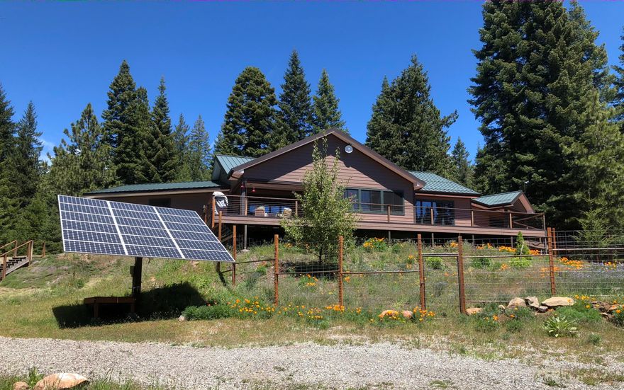 Live in comfort, peace & privacy at this immaculate passive-solar-designed mountain retreat with off-grid features, conveniently located only a minute from the Green Springs Inn! In addition to the exquisite single-level home, this 10 wooded acres features: a massive warehouse workshop (20' ceiling, 2 18' doors, heating, electrical, crane & shelving & tables) + 3 outbuildings (wood, solar & storage sheds), 2000-gal holding tank, solar panels & wood boiler. The 2005 home boasts 2014 sqft, 3 bedrooms & 2 bathrooms; Mahogany aluminum-clad Weather Shield windows, Mahogany doors & trim, travertine floors throughout; huge open kitchen w/ hickory cabinets & gas range; gas fireplace; built-in entertainment center; solid purple heart deck w/ covered sitting area; built-in speaker system inside & outside; & 2-car garage. The master bedroom has deck access, walk-in closet & bathroom w/ double sinks, soaking tub & shower. 5 mins to Hyatt Lake, 15 mins to Howard Prairie Lake and 25 mins to Ashland!