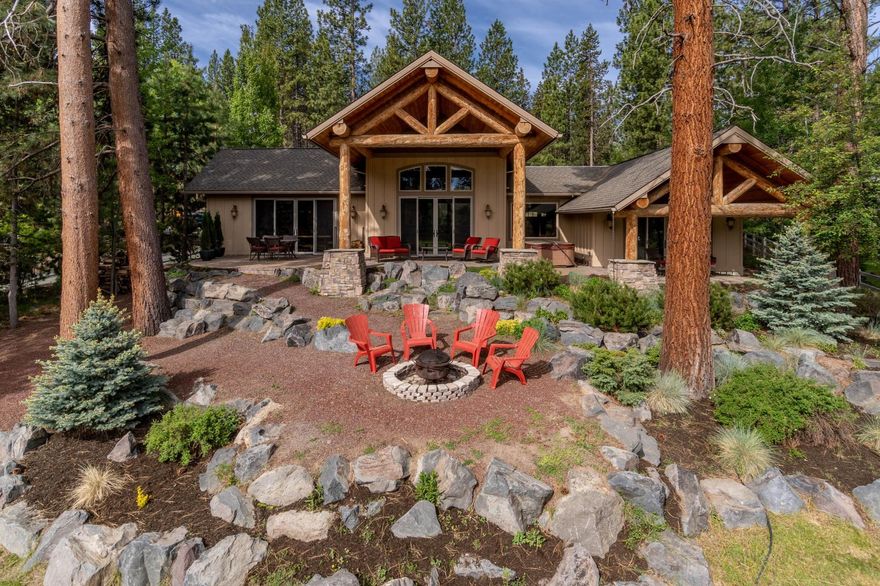 This is the riverfront home of which dreams are made. Offering incredible river views and tucked away on a quiet road, and nestled among the pines, this mountain retreat is designed for entertaining all seasons of the year. Large windows, high-end finishes, fire-resistant concrete construction, and heated custom flooring immerses guests in luxury, blending beautifully with the rustic allure of log beams and natural accents. A two-sided fireplace warms both the living & kitchen/dining areas. A chef's kitchen includes a breakfast counter, prep sink, & tons of storage. The adjacent laundry area doubles as both a mudroom, and a spacious butler's pantry for catered events, featuring ample counter space, sink, & large pantry. At the other end of the home, find a nicely separated main-level Mstr w/FP, river views, private patio, & spa-like bath. Above the garage, a large bonus area, and bathroom ensure it is perfectly suited for working from home, a second home, or nightly rental.