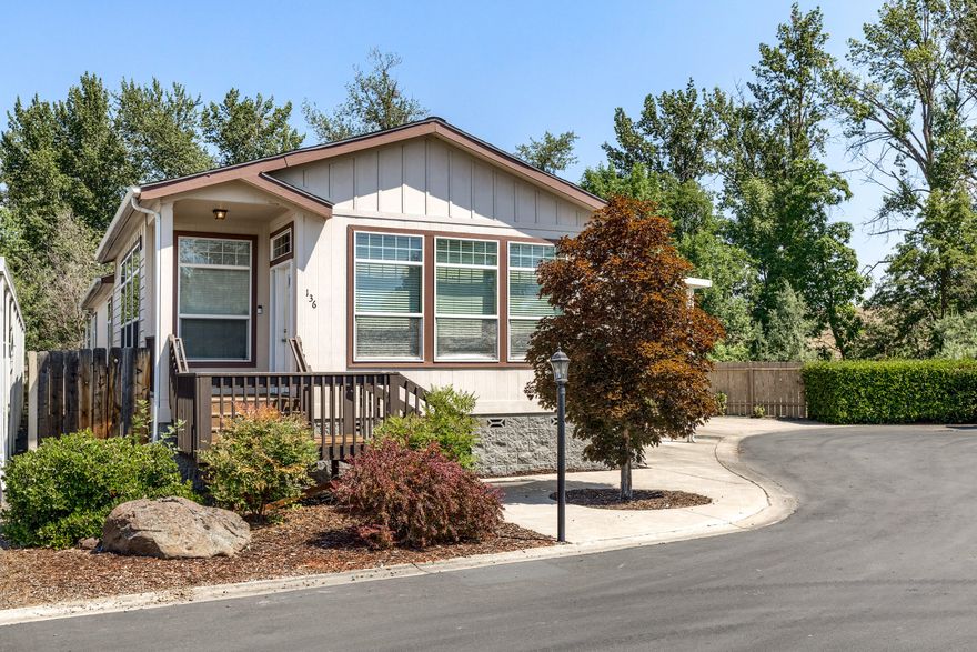 Tucked away in Medford Estates (all ages park), this move in ready 3 bedroom 2 bathroom home features a deck off the master, huge covered car port, storage shed and beautiful mountain views. Enjoy a cup of coffee in your private backyard while listening to the bird's chirp and water flow in Bear Creek.