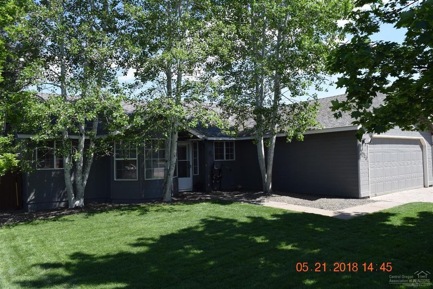 Beautifully remodeled single level home in a great neighborhood. This very well maintained home features; new interior/exterior paint, refinished cabinets & doors, new roof, high energy efficient ductless heat pump/air conditioning, new landscaping, new upgraded ceiling fans, new brushed nickel hardware throughout, newer stainless steel appliances, vaulted ceiling, tiled entry, raised garden beds w/sprinkler system, covered rear patio, storage shelving & workbench in garage & easy access to Hwy 97.