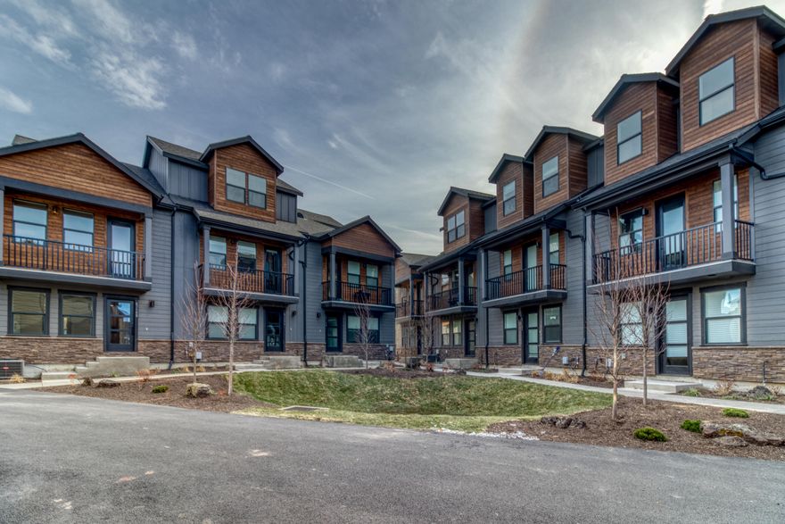 Welcome to Calaveras Luxury Townhomes, a new community in the heart of Bend offering award-winning design, quality & stunning views. Each unique floor plan features a 2 car garage, open concept living space, high ceilings & gourmet kitchen with eat bars. Fine finishes include Stainless Steel kitchen appliances, gas range, luxury vinyl plank floors, tile backsplashes, quartz countertops, wood accent walls & gas fireplace. The 'Tumalo' floor plan features more square feet, extra 1/2 bath & open main floor living. The 2nd floor is composed of the Primary Suite with private balcony, 2 more bedrooms + dedicated laundry. The vaulted 3rd floor family room could be an optional 4th bed or office. Each unit features a modern lodge style exterior paired with a NW contemporary interior highlighted by unique designer finishes. Conveniently located near popular locales like the Old Mill District, Deschutes River trails & an abundance of outdoor recreation. Experience the essence of Bend living!