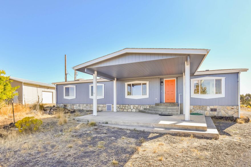 Don't miss this opportunity to live in Crooked River Ranch! This 1,560 sq ft manufactured home on 1.07 acres is the perfect spot to watch the sunset over the Cascades & enjoy ranch living. This home features 3 bedrooms, 2 bathrooms, new exterior paint, new carpet throughout & a large 1,080 sq ft shop!  There is an open concept kitchen w/ dining, a nice breakfast bar, new refrigerator, range, microwave & disposal.  There is a spacious living room w/ wood stove and just down the hall you'll find a separate office space/utility room,  hall bath, 2 bedrooms & primary w/ a walk-in closet & spacious bathroom. There is a nice back patio, covered front porch and plenty of parking w/ a wrap-around driveway. The shop has an upper storage space, separate room, 125 amp panel & 200 pwr. This lovely home is on a quiet cul-de-sac and Pavillion park is just around the corner. This community features a golf course, swimming pool, tennis courts, RV park, park w/ pavilion, trails and so much more!