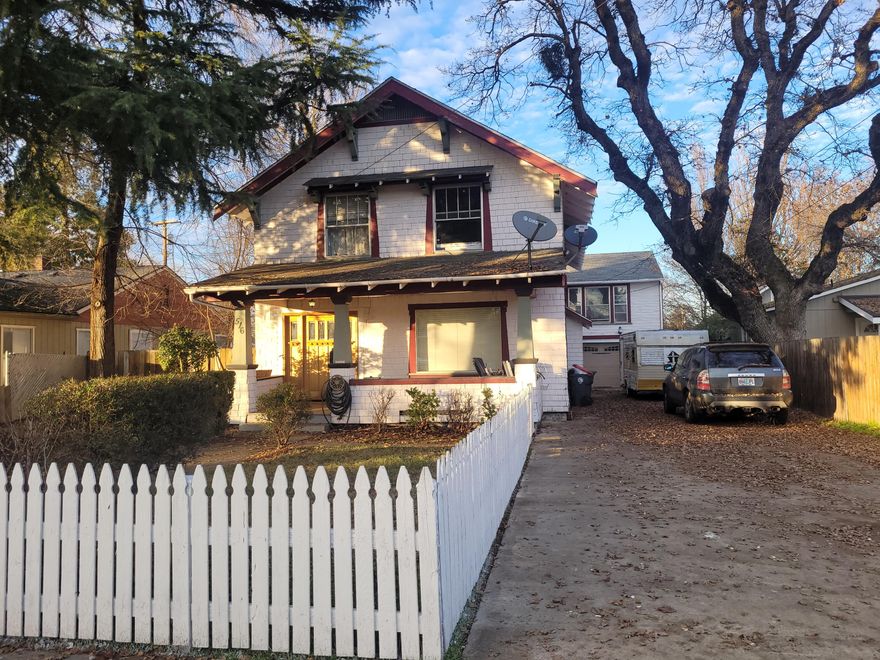 Need a 2-family setup, or immediate rental income? This restored home features 1,767 sf with 4 bedrooms and 2 full bathrooms in the main house, and that highly sought after detached ADU with 616 sf. The roofs do need replacement and various repairs, but lots of potential. The main house features newer oak kitchen cabinetry, copper farm style sink, gas range, all appliances included. Tastefully refurbished hardwood flooring, charming wood burning fireplace, and built-ins galore. One room has an enclosed sun porch, providing fresh air and natural light. Recently renovated bathroom vanities, new chimney, gorgeous front door, long double-wide driveway, and low maintenance front yard. Detached 2 car garage is oversized w/shop space and additional storage rooms. The ADU features wood paneled living and bed rooms, full kitchen with appliances, and a separate gas hot water heater. Brand new water heaters in main house and ADU. Listing is sold AS IS.