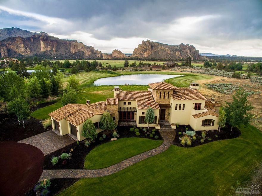 Villa De Lago, Lake Villa is a custom built, fully furnished home on 3.95 acres in the private Ranch of the Canyons estate. Lakefront & Smith Rock views, Master on the main level, Doug Fir beams, distressed plank floors, 8 ft. exterior doors. Italian artistry in every detail, including stone towers/accents. Viking stove surrounded by stone & exposed beams & framed views thrughout, + 900sf covered patio.
