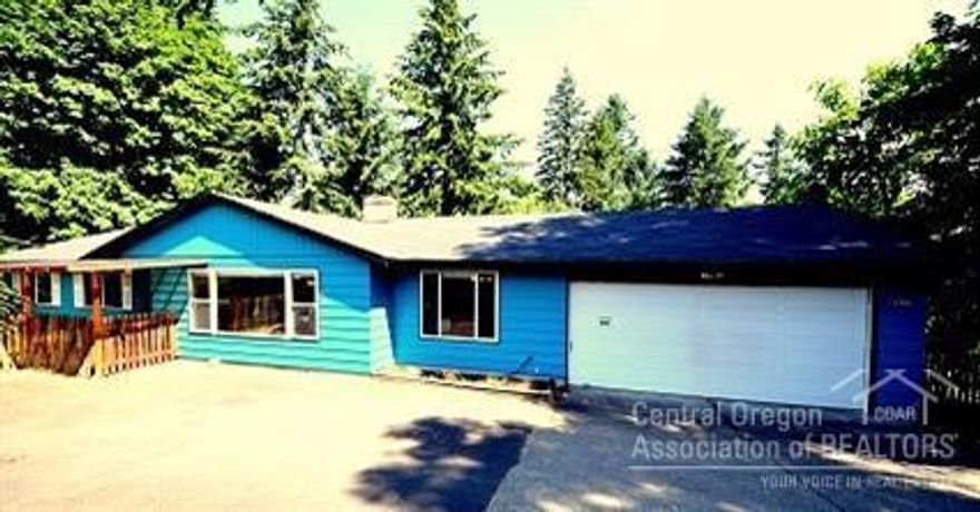 Large ranch style home w/a large daylight basement. Two living areas with separate entrances & w/two kitchens. Huge wrap around deck w/sliders & french doors, bamboo wood floors, ductless heating on both levels & wood stove insert in the upstairs living area & fireplace in the downstairs living area. ADA accessible. Insulated shop w/power. The lot is .88 acre that is potentially dividable. Application to divide was submitted in 2006, buyer to do their own due diligence with the city.