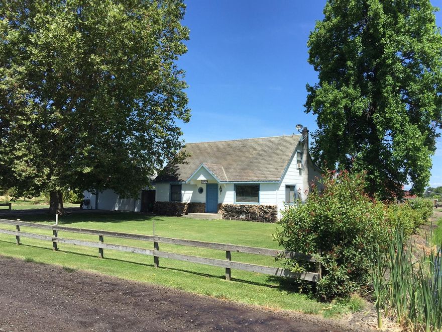 Back on market, no fault of seller, w/ $10,000 price reduction! This is a very special property for a GREAT value! Includes a brand new roof. 2 beautiful acres surrounded by sweeping mountain views and bisected by Anderson creek. You will not find another like it - so close to Talent and at this price which was JUST reduced $10,000! The home is 2090 sqft with 3 bedrooms and 2 bathrooms. There is a well-constructed pole barn and a detached extra large finished garage that can fit 4 cars parked in tandem. Attached to garage is wood shop (w/ 3/4 bath) and shed. There's space for 2 RVs - one with water and electric hookups on a concrete pad and the other with sewer hookup. The property is fully irrigated with TID through a sprinkler system around the house and a flood system for the acreage in the back. This is an amazing piece of land with even greater potential. Lots of water!