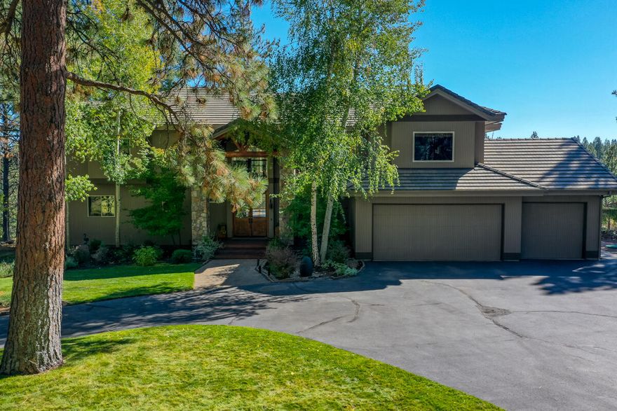 Perched above the Deschutes River gorge, this unique Northwestern style home has views of the river from inside the house and the back deck. From the front door you walk into an elegant living room with vaulted ceilings, clear story windows, hard wood and travertine floors, built in wood shelving and a combo gas and wood burning fireplace with stone surround. Large kitchen remodeled 5 years ago with Quartz counters and island that seats 4 with built-in Wolf Induction cook top, and stainless-steel appliances, breakfast nook which opens to the back deck. This 4966 sq ft home has a bedroom and bath on the first floor plus the office. The primary upstairs bedroom is a large and has views of the river flowing toward you, room for a sitting area in front of a gas fireplace with slate surround. The fireplace is two sided, next to the soaking tub in the bathroom with a walk-in tile shower and double vanity. Two additional on suite bedrooms upstairs and media room. 3 car garage with work shop.