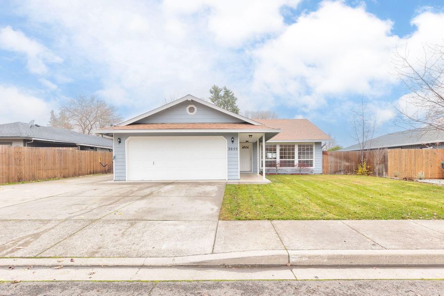 Welcome to this East Medford gem in Sheraton Village Subdivision! This 3-bedroom, 2-bathroom single-level home offers 1,420 sq. ft. of light-filled living space. Oak hardwood floors flow through the main areas, and vaulted ceilings create an open feel. The remodeled guest bathroom features a tile tub surround, quartz vanity, and updated lighting. The spacious primary suite includes an ensuite bath and a large closet. The kitchen boasts ample counter space, a long peninsula, and a breakfast bar. Outside, enjoy a landscaped backyard, fenced dog area, and RV parking for up to a 50' unit. Additional features include central air, double-pane windows, and a smart thermostat. Located near top schools and in a peaceful cul-de-sac, this move-in-ready home is a must-see. Listed at $379,999—schedule your showing today!