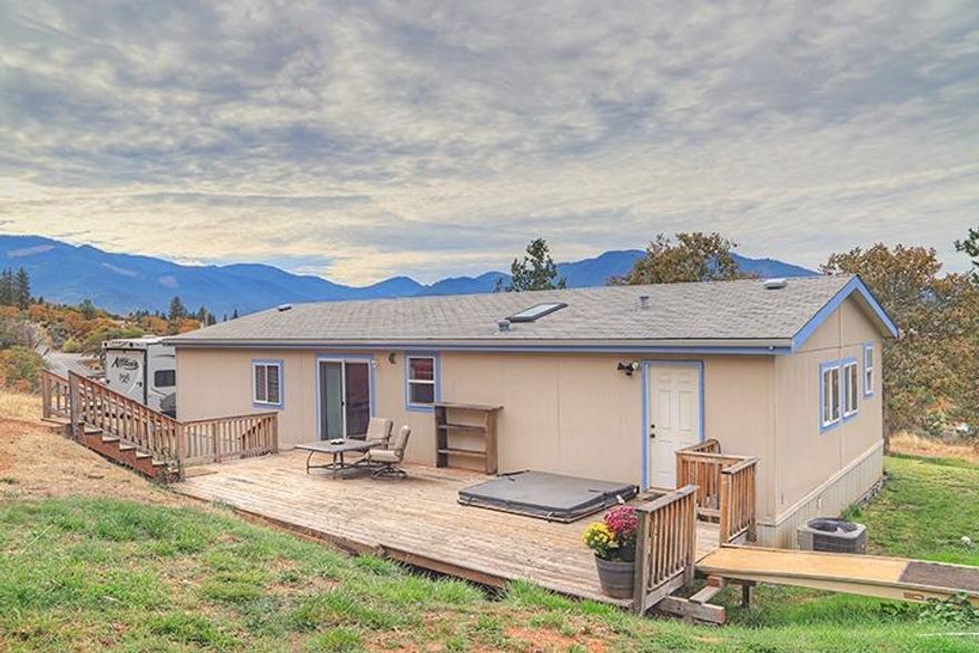 Beautiful rural flag lot property in Southeast Grants Pass! Three bedroom two bath home with a den that could be used as a office or extra room! 1512 SqFt on 5.08 level sunny acres! This home has new carpet with extra thick padding throughout, brand new HVAC system, all new ducting, updated plumbing, huge deck out the back slider, brand new decking out front, inset hot tub, 10x20 shed and a 12x12 SHOP with electricity and 220 AMP for all you power tools. This property is peaceful and private with beautiful mountain views. Only minutes from town! Call me to see this today!CHECK OUT MY DRONE VIDEO ON THIS GREAT PROPERTY!