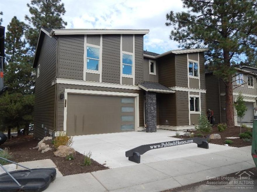 Last home left in Awbrey Woods. Quality west side Pahlisch contemporary home features quality Pahlisch construction/craftsmanship throughout. Special features include upgraded tile floors in baths & utility. The spacious master suite offers a sitting area/large walk in closet. Well designed kitchen/great room areas open onto patio. Covered porch greets your guests. Entertaining bar, built in desk area, solid countertops, stainless appliances/stone fireplace featured in this new west side Bend home.