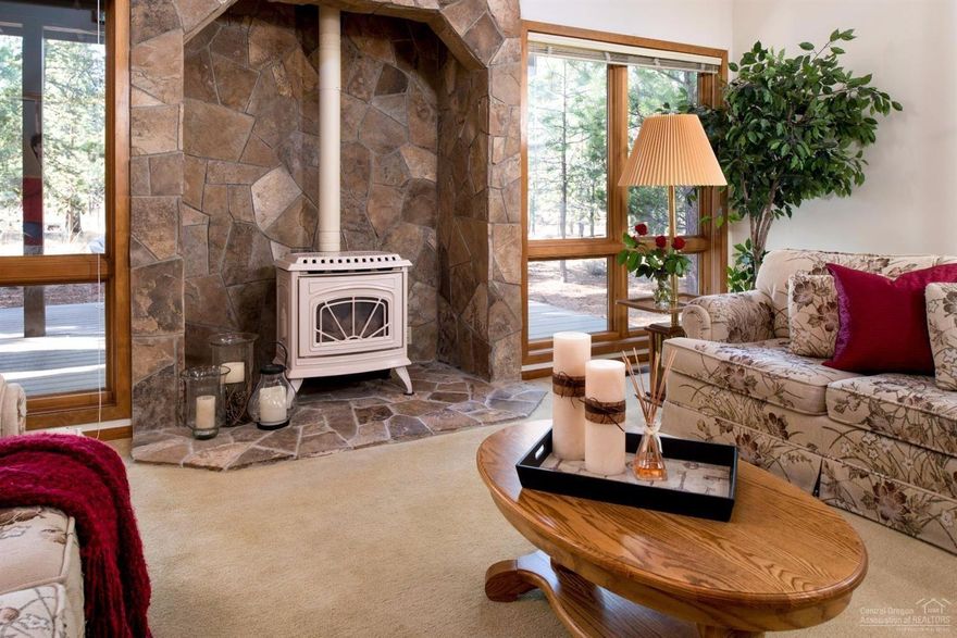 A rare opportunity to own a custom built original owner home. Enjoy the wall of windows that look out onto the open common area & flood the room with light. Free standing gas stove in the vaulted great room. Newer stainless steel appliances in the open kitchen w/ eating bar. Master suite offers a sitting area/ office area + huge walk in closet & storage. Lovingly maintained & never been rented. Furnace, tankless hot water heater, A/C & roof are 5 years new. Covered Trex Deck. SHARC paid!