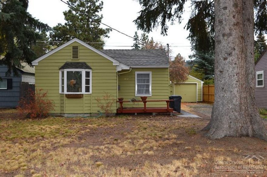 In the heart of NW Bend, this classic 1917 Mill period charmer is searching for a loving buyer to appreciate and care for the shelter it has provided. Only one block away from Harmon and Drake Park, this home has had some updating over the last few years including refinishing of the wood floors, paint throughout, and updating of the bathroom and kitchen. French doors off the master open to the backyard. Home is situated on a large lot with alley access. There is a single car detached insulated garage/shop.