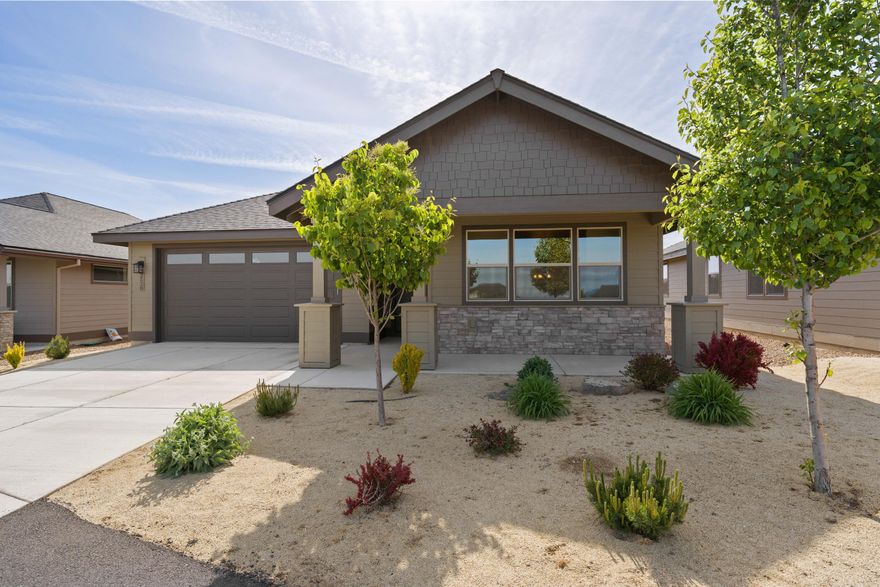 Beautifully designed and move-in ready! This warm, inviting home offers an open layout with a cozy gas fireplace and bright breakfast nook. Gourmet kitchen with quartz counters, stainless appliances, and ample storage. Spacious primary suite and covered patio for outdoor relaxation. Located in a 55+ gated community with a new clubhouse under construction featuring an indoor pool, pickleball, gym, bocce ball, and second floor observation deck. Close to trails, golf, dining, and shopping.