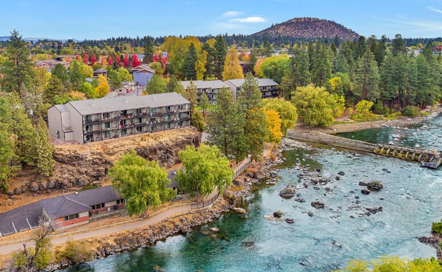 Awesome Deschutes River views from this second floor Condo. Currently a Short Term Rental.  One ''lockoff'' bedroom, 2 full bathrooms, plus a queen murphy bed. Plenty of storage, generous kitchen with an peninsula and granite countertops.  West side location, walking distance to downtown, river trail and Pioneer park.  This vacation rental comes furnished and ''turnkey''  HOA dues cover practically everything: Indoor pool, Internet, Cable tv, utilities, exterior maintenance and snow removal. New $7K heating, cooling unit.