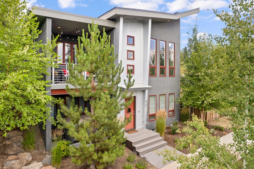 Welcome to this contemporary home situated in the Westside corridor in the heart of Bend. This masterpiece of design and craftsmanship embodies a perfect blend of concrete, wood, and steel, exhibiting a unique modern industrial aesthetic. Primely located, this home boasts unparalleled convenience to outdoor recreation, minutes away from trails, rivers, and mountains. For those who enjoy the city's allure, the home is central to Bend's dining scene and shopping destinations. It uniquely unites the appeal of city living and the tranquility of nature. Revel in the opulence of the main level primary suite, brimming with natural light and showcasing a finely designed bathroom. The open floor plan exudes a warm, inviting ambiance, perfect for entertaining or relaxing. The state-of-the-art kitchen is furnished with high-end appliances and sleek countertops, set against a backdrop of modern design elements. Experience a touch of luxury and convenience in this remarkable Westside home.