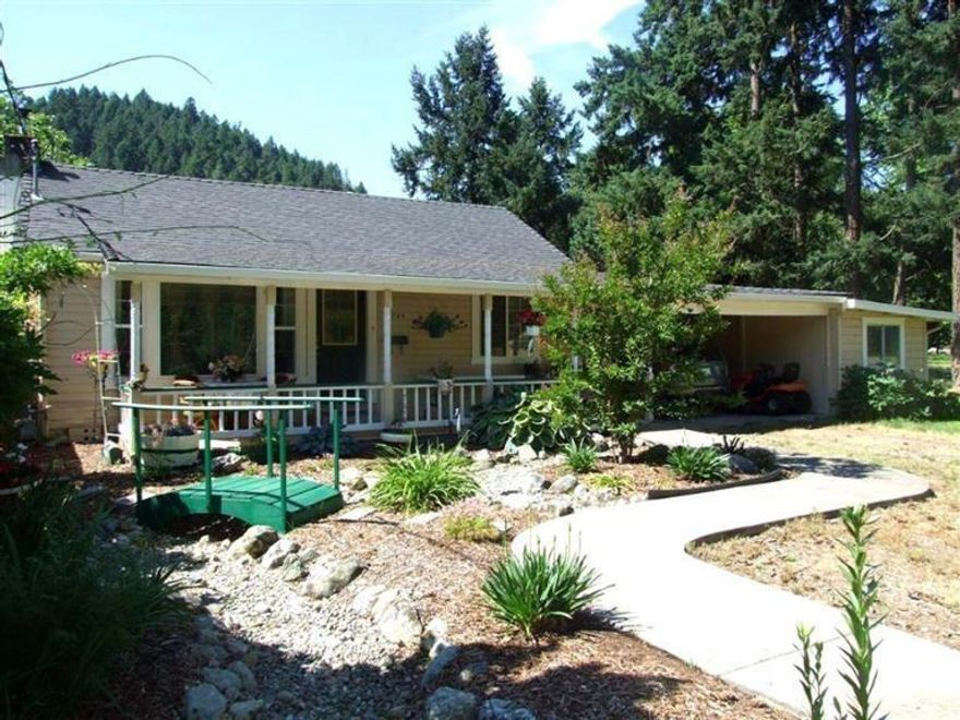 Take a tour of this private country home on over one acre. Nice 2 bed 1 full bath home has been beautifully updated with new flooring and a 2 year old roof. Enjoy sunrises and sunsets on the cute covered porch with breezeway to carport and shop area. Cozy 480 sq ft 1 bedroom 1 bath guest house behind main home. This property is level with beautiful mountain views, in-ground sprinklers, irrigation rights, raised garden beds and storage sheds. Property is completely cross fenced with electric gate entry. Schedule a tour today!