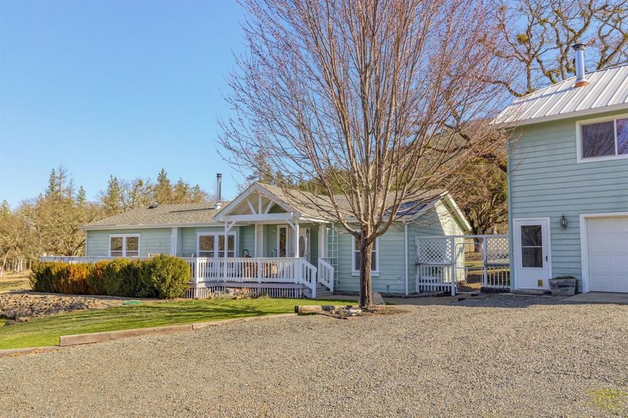 Roam, Ramble and Relax on this beautiful 10.14 acres with beautiful mountain views. Featuring a 3 bedroom, 2 bath immaculate home with 1512 sf. Sunny and bright kitchen with snack bar, oak cabinets and laminate floor. Living room has large windows to take in the views, cozy wood stove and vaulted ceiling. Master suite with walk-in closet, window seat, built-ins, jetted tub and separate shower. You will love the split floor plan, ceiling fans, hardy-plank siding and lots of storage. Front deck is a perfect place to relax and take in the surrounding beauty. Friends and family will love the private 528 sf guest quarters. Two detached garage/shops; at 528 and 864 sf. Covered RV parking. Storage shed, established garden area. Bordering Williams Creek. Welcome home to all that nature has provided. Don't miss the virtual tour.