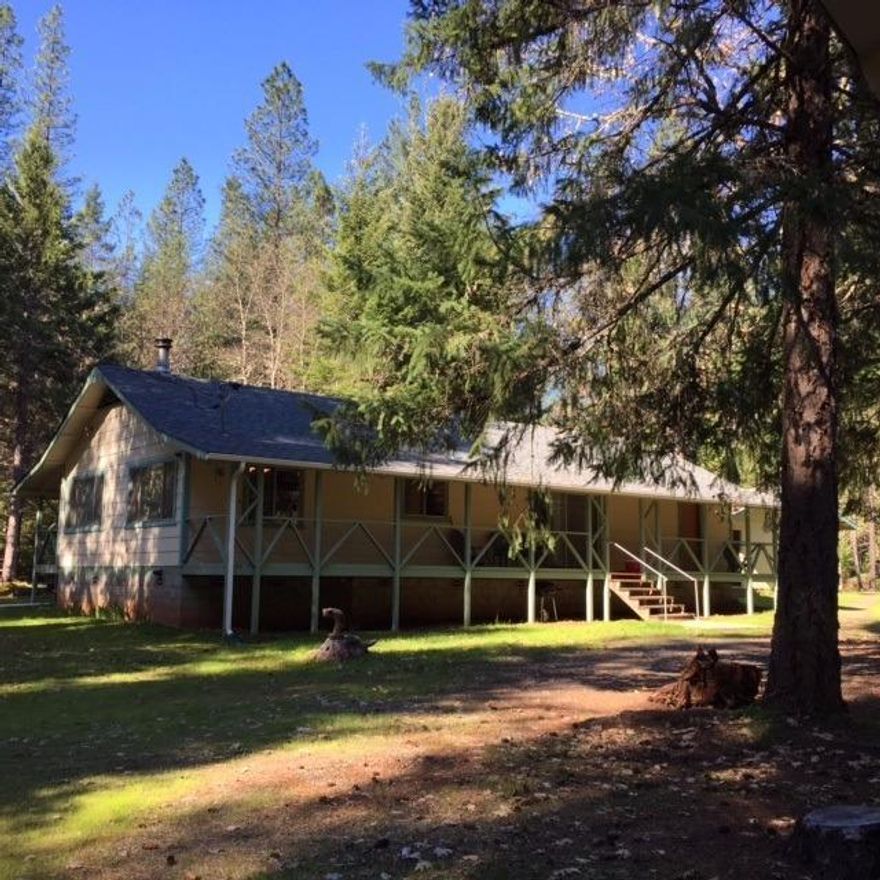 This Solid Site Built home is Nestled in the woods. Enjoy the wildlife from the Large front or back porches. The home features an open floor plan with custom wood work through out. There is a charming one bedroom/one bath unfinished guest house and large detached garage.