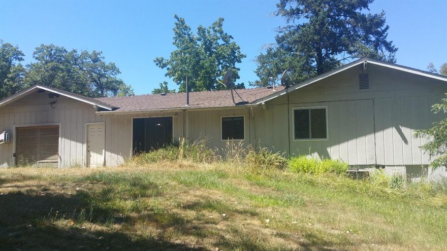 This home needs some TLC but will be a nice place in the country to call home. Gated entry. Garage, deck and lots of trees makes this a nice spot to call home. All info deemed accurate but not guaranteed and subject to change at any time.