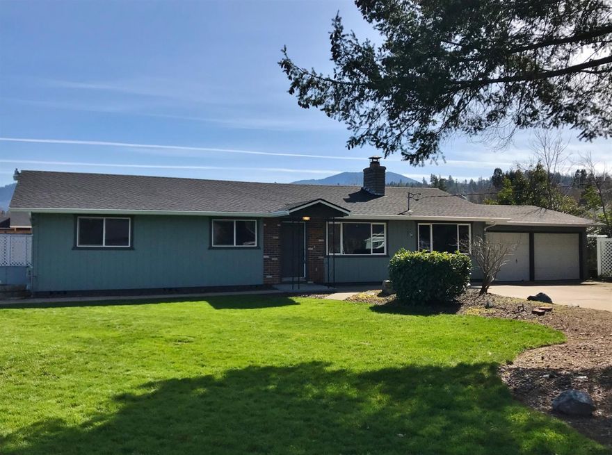 Updated in 2019 with newer amenities such as new roof, fresh interior/exterior paint, newer glass top range/oven, new microwave, partial new cabinetry and counters, antiqued/distressed cabinetry, new Milgard vinyl windows, new carpet w/base molding, granite bathroom counter, tile shower surround, updated doors, custom closet shelving, updated light fixtures. This home has a large front yard with mature landscaping, underground front sprinklers w/GPID and deeper driveway with room for small RV. Home is tastefully updated and remodeled in 2019. Grants Pass District 7 schools. Located near Allen Dale Elementary. Minutes to Asante, town, parks and schools.